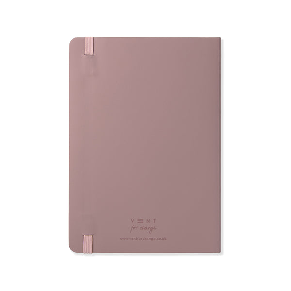 Pink leather notebook in A5 size with roses and flowers band on a white background. 