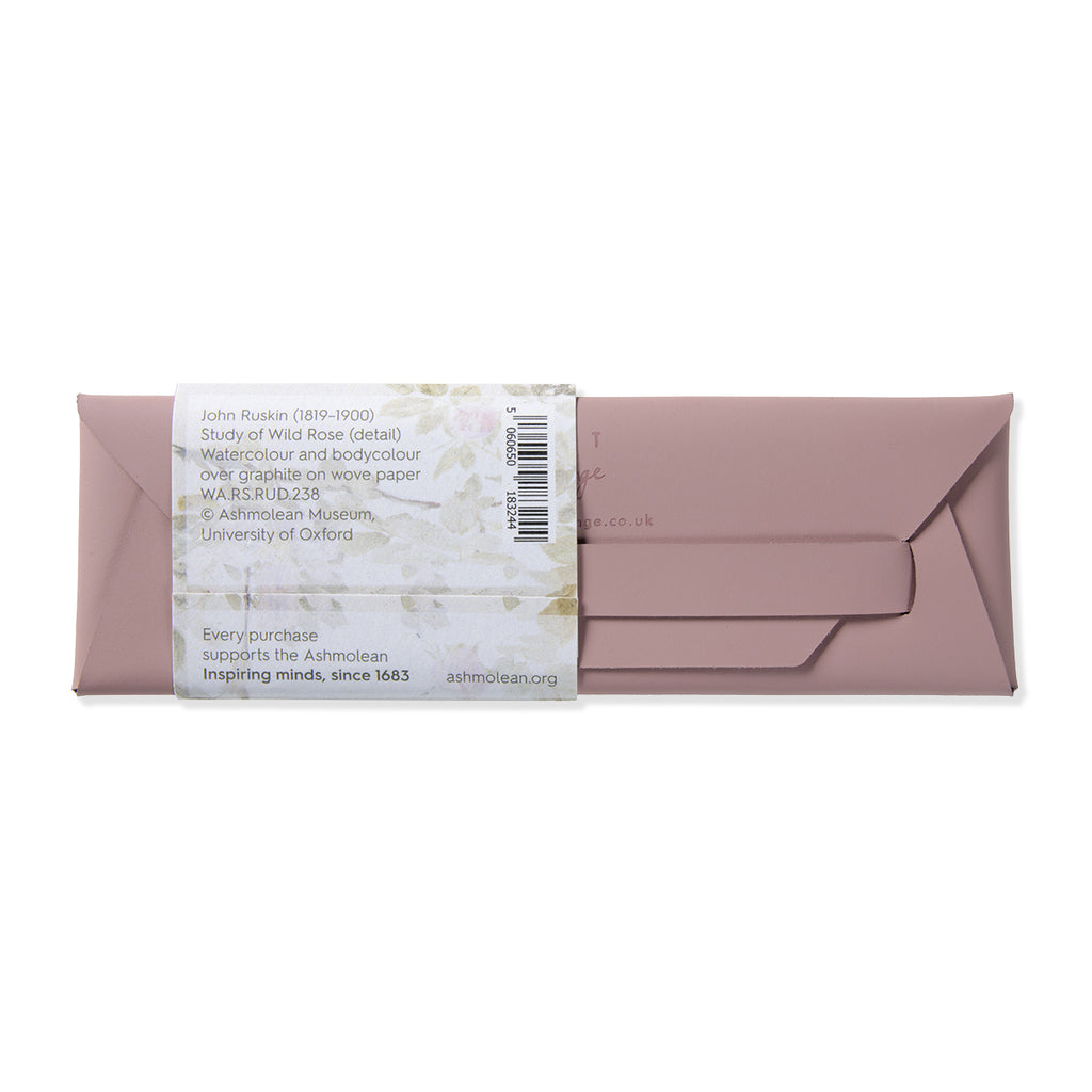 Pink leather pencil case envelope with a label on a white background