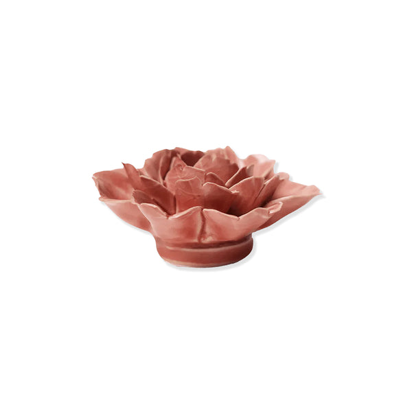 Pink ceramic rose flower on a white background.