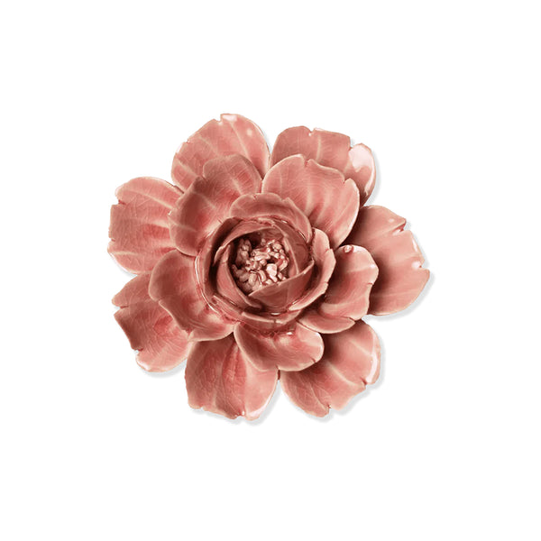 Pink ceramic rose flower on a white background.