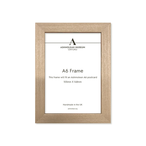 Wooden picture frame with Ashmolean Museum label on a white background