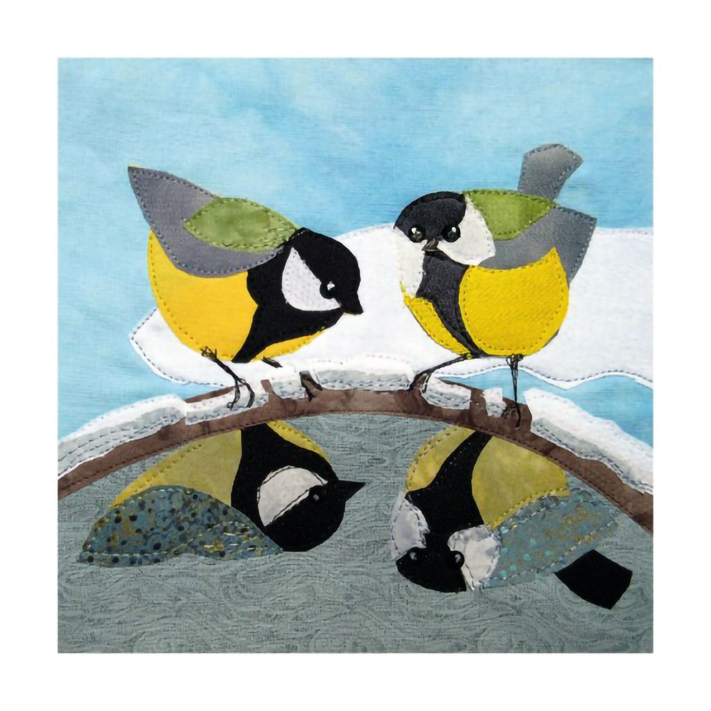 Two great tit birds perched on a branch above water with a blue sky background