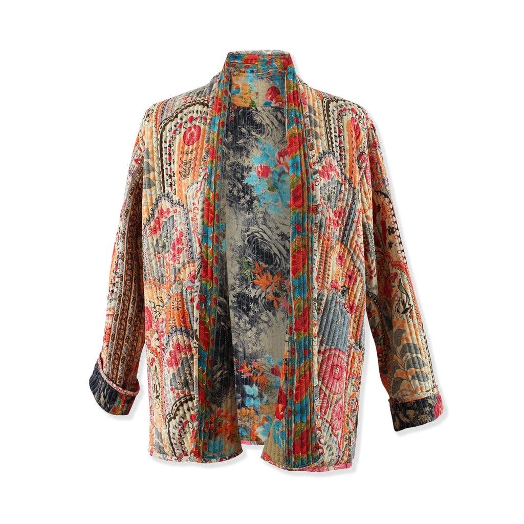 Colourful patterned quilted jacket on a white background