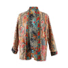 Colourful patterned quilted jacket on a white background