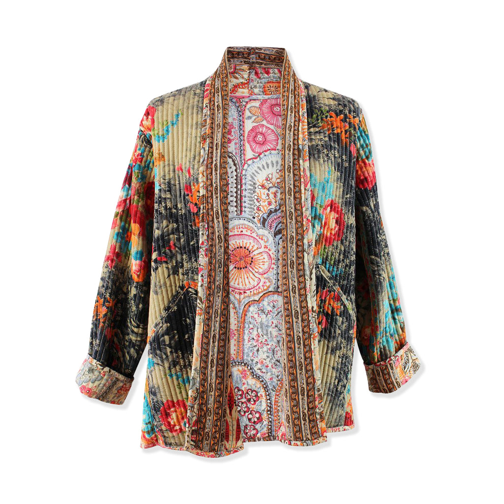 Colourful patterned quilted jacket on a white background
