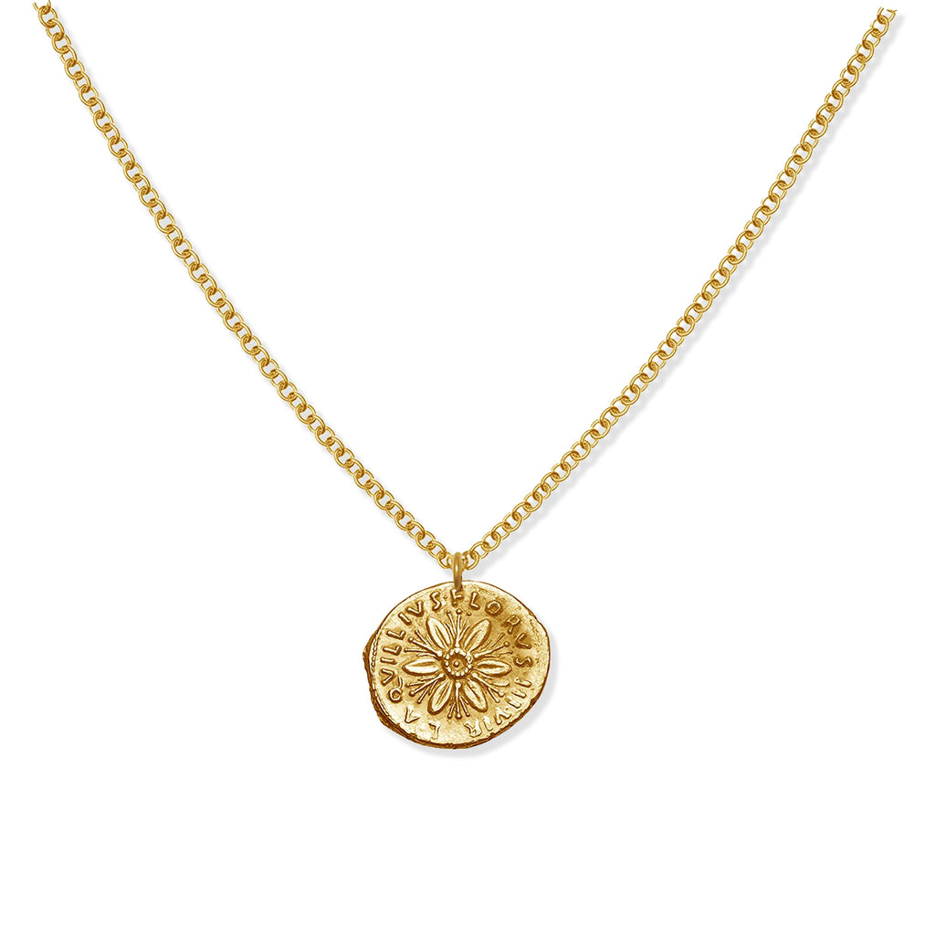 Gold necklace with a floral pendant on a white background