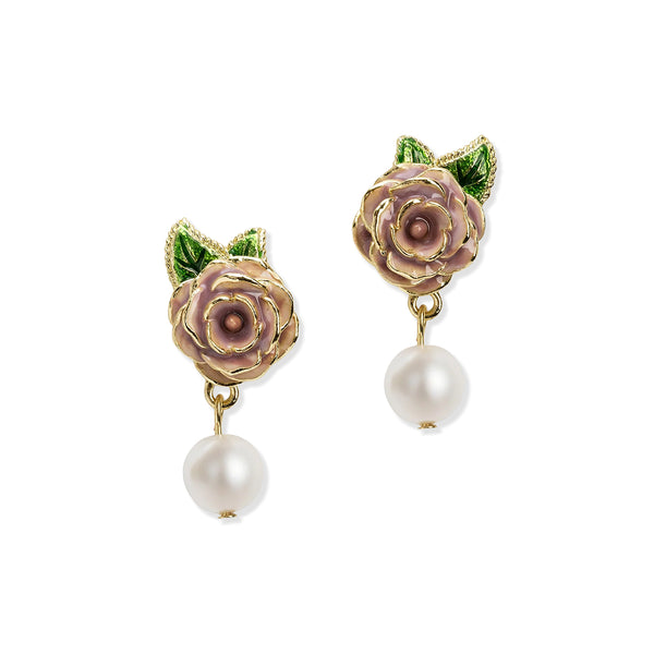 Pair of earrings with pink floral designs and pearl drops on a white background