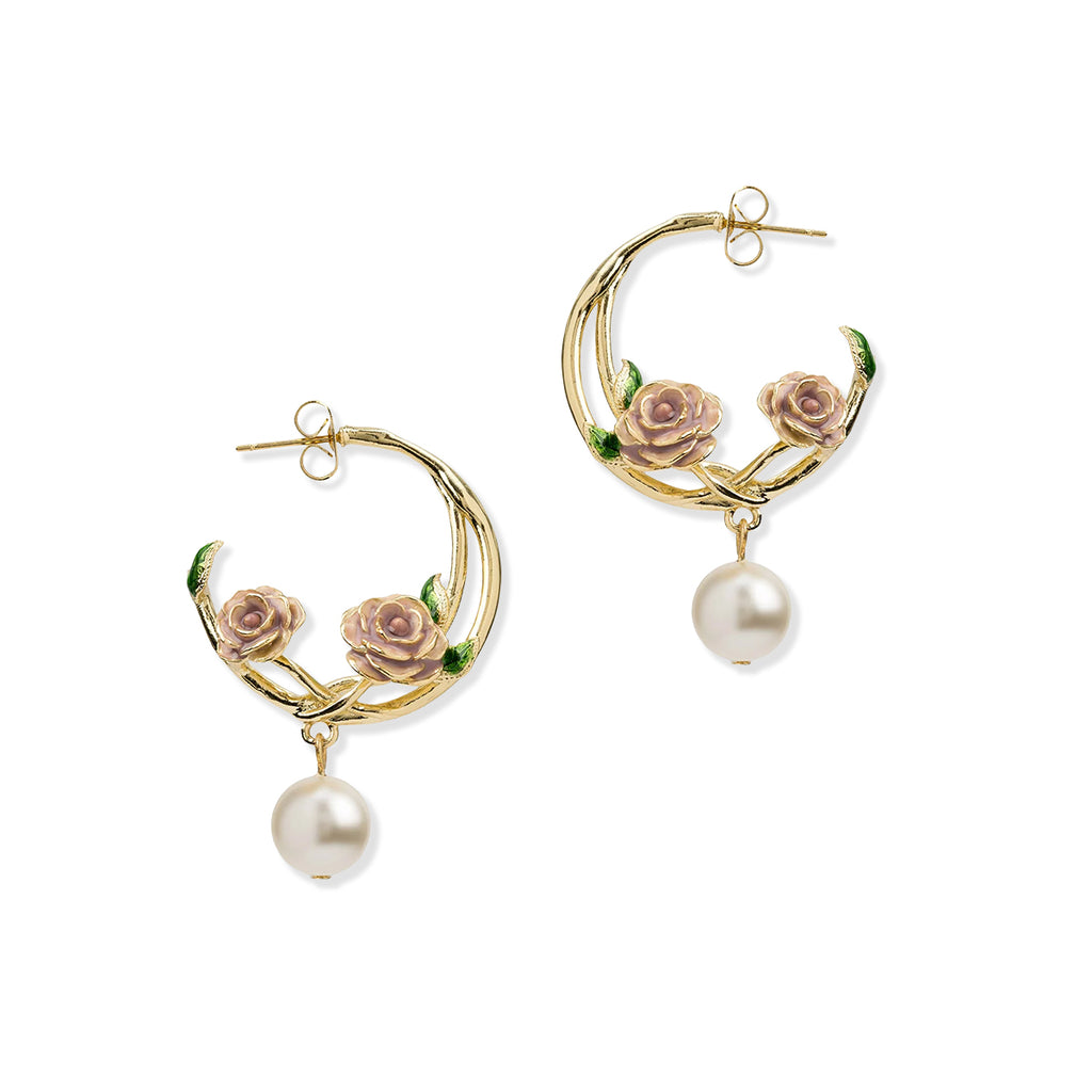 Gold hoop earrings with floral designs and pearl drops on a white background