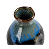 Ceramic vase with blue and brown glaze on a white background