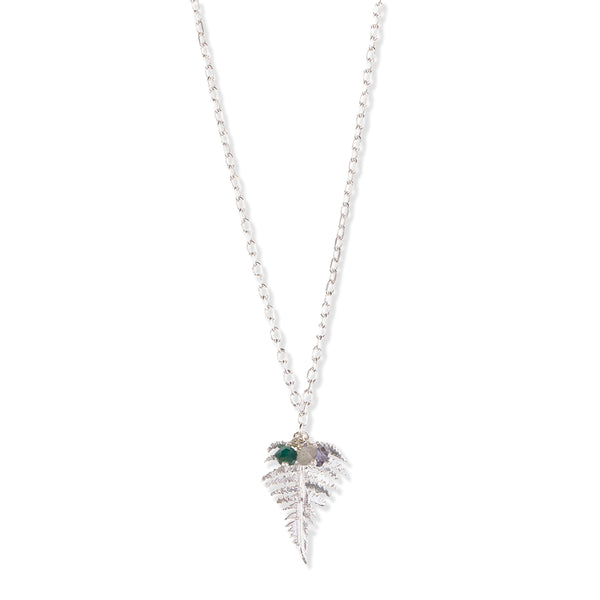 Silver fern leaf necklace with colourful gemstone beads on a white background.