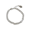 A silver metal charm bracelet on a white background.