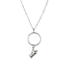 Silver necklace with a round pendant and smaller charm on a white background