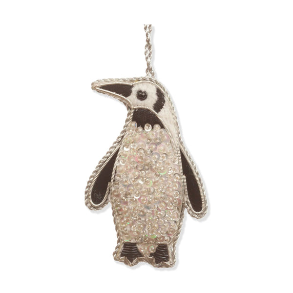 Penguin ornament with rhinestone detailing on a white background