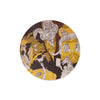 Round coaster with artistic design on a white background