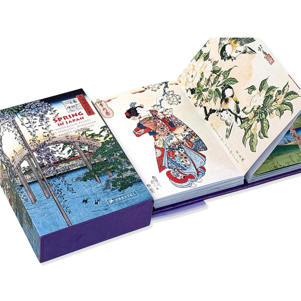 Opened pages of Spring in Japan book showing traditional colourful Japanese woodblock print artwork on a white background.