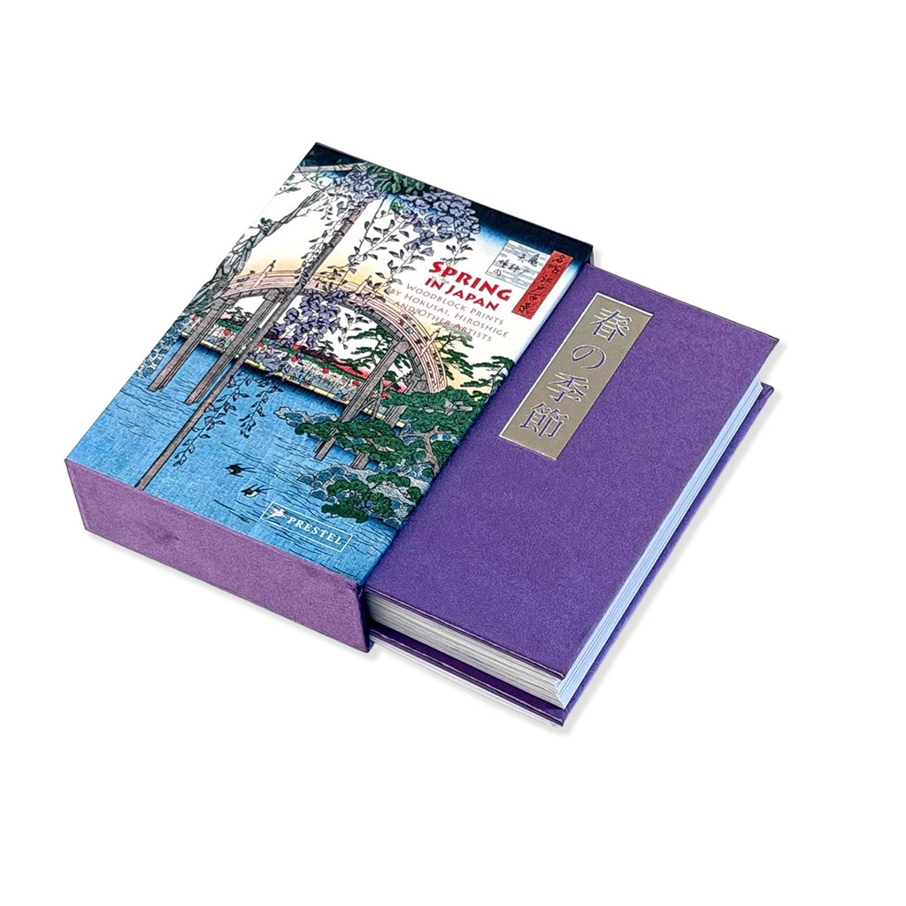 Hardback cover and purple slipcase of Spring in Japan book on a white background.