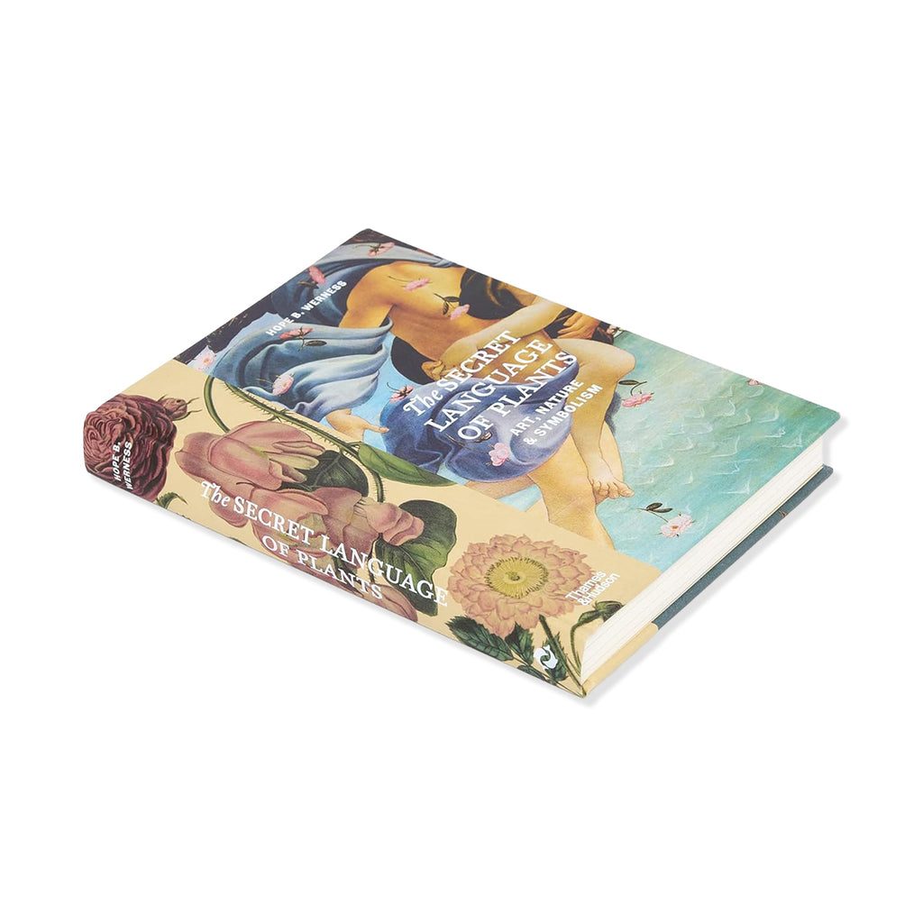 Side view of The Secret Language of Plants hardback book with artistic depiction of woman and plants against a white background.