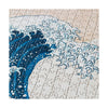 Close up detail image of jigsaw puzzle with a blue wave design on a beige background