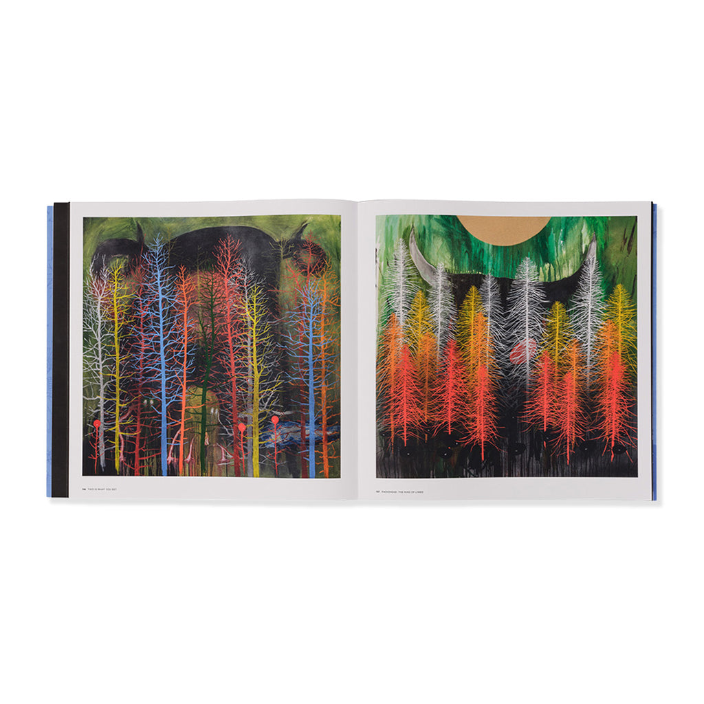 Open book showing a colorful illustration of trees and animals on a white background