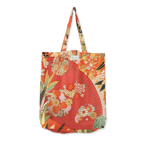 Red and orange canvas tote bag with Japanese cranes and large hand fans with eucalyptus leaves pattern on a white background.