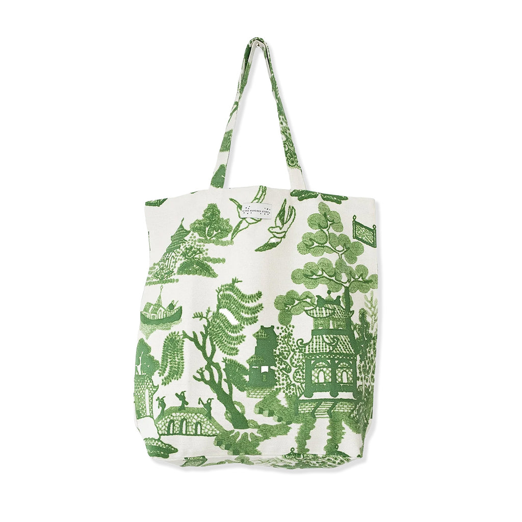 Cotton canvas tote bag with green willow oriental pattern on a white background.
