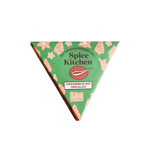 A triangular wrapped hot chocolate from Spice Kitchen, featuring a green wrapper with gingerbread cookie illustrations and the text 'Gingerbread Hot Chocolate'.