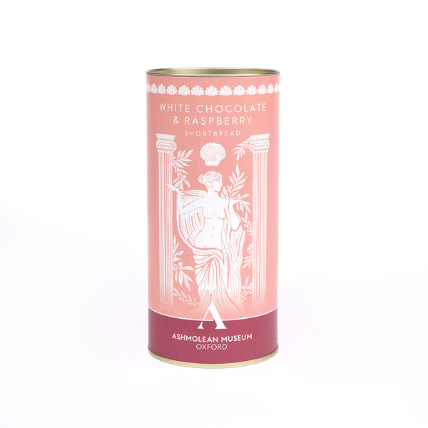 A cylindrical tin of White Chocolate & Raspberry Shortbread from the Ashmolean Museum, Oxford, featuring a pink and burgundy label with white classical illustrations.