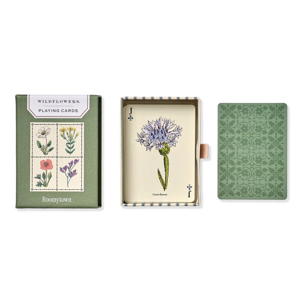 Open pack of wildflower playing cards with Jack of Clubs shown with cornflower illustrated artwork on card and green patterned backing on a white background. 