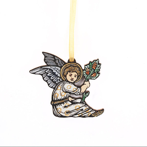 An angel Christmas ornament featuring a kneeling angel with wings and a gold halo, holding a green wreath, suspended by a gold ribbon on a white background.