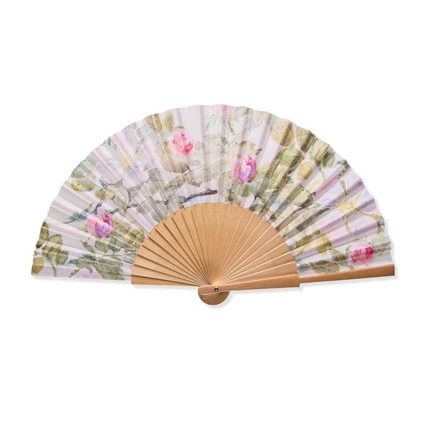 Wooden hand fan with John Ruskin Wild Rose artwork in pink and cream colours on white background.