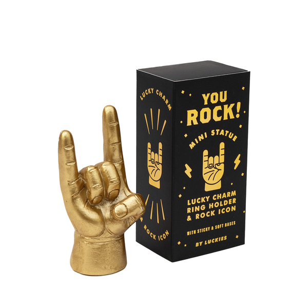 Gold hand icon Lucky Charm ring holder with packaging on a white background