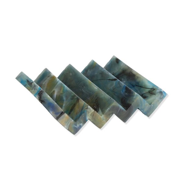 Deep blue marble effect recycled plastic soap dish with zig zag design on a white background.