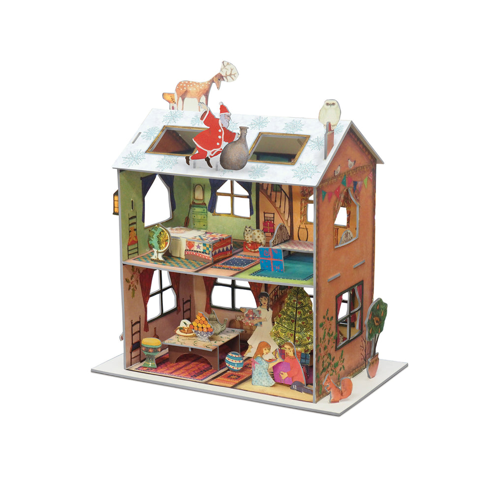 A detailed miniature dollhouse featuring a Christmas theme, with Santa Claus on the roof, a reindeer, and festive decorations inside the rooms, shown on a plain white background.