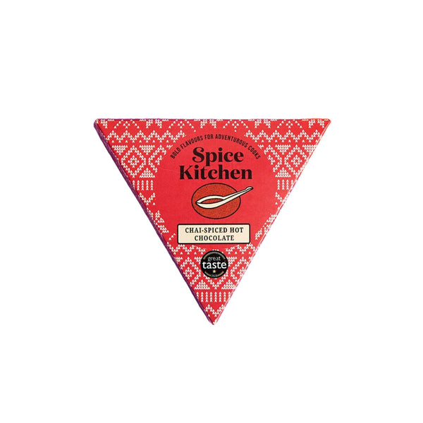 A triangular package of Spice Kitchen Chai-Spiced Hot Chocolate on a plain white background.